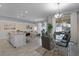 Bright open-concept living area featuring modern furnishings and sliding glass doors at 1565 Plunker Dr, Davenport, FL 33896