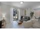 Bright living space with a sliding glass door, modern decor, and contemporary furnishings at 1565 Plunker Dr, Davenport, FL 33896