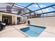 Enclosed pool area with a swimming pool, lounge chairs, and patio furniture for outdoor relaxation and entertainment at 1565 Plunker Dr, Davenport, FL 33896