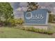 Attractive Oasis Clubhouse sign amidst lush landscaping and manicured lawn at 1565 Plunker Dr, Davenport, FL 33896