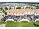 A high altitude shot shows the community's private pool and patio, screened in for privacy, providing outdoor space at 1578 Slice Way, Davenport, FL 33896