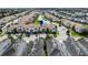Community aerial view showcasing the well-maintained townhomes with tiled roofs and lush landscaping at 1578 Slice Way, Davenport, FL 33896