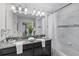 Bathroom featuring double sinks, granite counters and a shower/tub combo at 1578 Slice Way, Davenport, FL 33896
