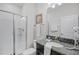 Bathroom with shower, toilet, sink, and plenty of counter space at 1578 Slice Way, Davenport, FL 33896