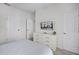 This bedroom has a dresser with a flat screen TV and 2 doors for convenient access at 1578 Slice Way, Davenport, FL 33896