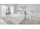 Cozy bedroom with plush pillows and ample natural light from the bright window at 1578 Slice Way, Davenport, FL 33896