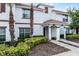 Well-maintained townhome exterior with manicured landscaping and inviting entrance at 1578 Slice Way, Davenport, FL 33896