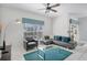 Bright living room with a modern decor, featuring tile floors and an accent rug at 1578 Slice Way, Davenport, FL 33896