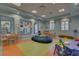 Community playroom featuring colorful chairs, tables, beanbag and lots of windows at 1578 Slice Way, Davenport, FL 33896