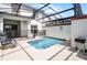 A refreshing pool with a screened-in enclosure and plenty of seating at 1578 Slice Way, Davenport, FL 33896