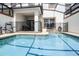 A close up of the pool with a safety fence surrounding it at 1578 Slice Way, Davenport, FL 33896