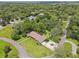 Neighborhood of homes surrounded by green trees, with a serene, wooded atmosphere in a suburban location at 16 Pine Forest Dr, Haines City, FL 33844