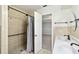 Bathroom showcasing a shower with gray curtain and dual sink vanity at 16 Pine Forest Dr, Haines City, FL 33844