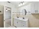 Inviting bathroom featuring double sinks, cabinetry, and modern lighting at 16 Pine Forest Dr, Haines City, FL 33844