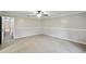 A well-lit bedroom showcases neutral walls, carpeted flooring, and ample space for creating a cozy retreat at 16 Pine Forest Dr, Haines City, FL 33844