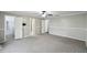 Expansive bedroom featuring neutral tones, carpeted flooring and multiple entry points for a versatile layout at 16 Pine Forest Dr, Haines City, FL 33844