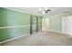 Spacious bedroom features a ceiling fan, carpet, a closet, and a window bringing in lots of natural light at 16 Pine Forest Dr, Haines City, FL 33844