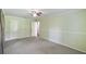 Spacious bedroom featuring neutral carpet, a ceiling fan, and traditional trim at 16 Pine Forest Dr, Haines City, FL 33844
