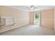 Bedroom with a ceiling fan, carpet, a built-in desk, and a window bringing in lots of natural light at 16 Pine Forest Dr, Haines City, FL 33844