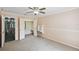 Bedroom featuring a ceiling fan, carpet, closet, and ensuite bathroom access creating a Primary suite at 16 Pine Forest Dr, Haines City, FL 33844