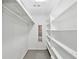 Spacious walk-in closet featuring built-in shelving and storage at 16 Pine Forest Dr, Haines City, FL 33844