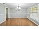 Bright dining area with large window and modern chandelier at 16 Pine Forest Dr, Haines City, FL 33844