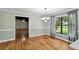 Elegant dining room with hardwood floors, chandelier, and wainscoting detail at 16 Pine Forest Dr, Haines City, FL 33844