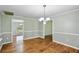 Bright dining room with hardwood floors, wainscoting, and ample natural light at 16 Pine Forest Dr, Haines City, FL 33844