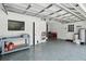 Large garage features epoxy flooring, storage racks, and ample workspace at 16 Pine Forest Dr, Haines City, FL 33844