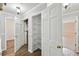 Hallway closet with white shelving offers practical storage space and enhances the functionality of the home at 16 Pine Forest Dr, Haines City, FL 33844