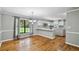 Spacious kitchen and dining area featuring white cabinets, stainless steel appliances, and ample countertop space at 16 Pine Forest Dr, Haines City, FL 33844