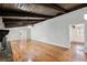Open living room features wood beam ceilings and fireplace with stone surround at 16 Pine Forest Dr, Haines City, FL 33844