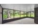 Screened in porch showcasing lush landscaping and serene outdoor living at 16 Pine Forest Dr, Haines City, FL 33844