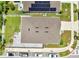 Bird's-eye view of a single-Gathering home's roof, backyard patio, and street parking, and solar panels at 1600 Spray Ter, St Cloud, FL 34771