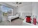 Bright bedroom with a large window, neutral walls, carpet flooring, and light wood furniture at 1600 Spray Ter, St Cloud, FL 34771