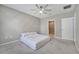 Bedroom with neutral colors, a geometric accent wall, and bathroom access at 1600 Spray Ter, St Cloud, FL 34771