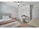 Comfortable bedroom with neutral paint, carpet flooring, fan, and white furniture at 1600 Spray Ter, St Cloud, FL 34771