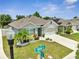 Well-maintained single-Gathering home with a lush front yard, a two-car garage, and attractive landscaping at 1600 Spray Ter, St Cloud, FL 34771