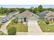 Charming single-story home featuring a manicured lawn and two-car garage, set against a clear, sunny sky at 1600 Spray Ter, St Cloud, FL 34771