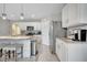 Well-equipped kitchen with granite countertops, stainless steel appliances, and bar stool seating at 1600 Spray Ter, St Cloud, FL 34771