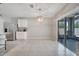 Eat-in kitchen features stainless appliances, white cabinets, and access to the lanai at 1600 Spray Ter, St Cloud, FL 34771