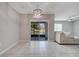 A lanai view with open space to the backyard and a bright chandelier at 1600 Spray Ter, St Cloud, FL 34771