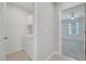 Well-lit laundry room with a washer, dryer, and storage cabinets conveniently located near the bedroom at 1600 Spray Ter, St Cloud, FL 34771