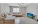 Bright and spacious living room featuring a sectional sofa and tile flooring at 1600 Spray Ter, St Cloud, FL 34771