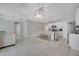 Open floor plan with kitchen island and dining space with lots of natural light at 1600 Spray Ter, St Cloud, FL 34771