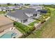 A large home with a backyard that has an outdoor kitchen and a swimming pool at 16049 Volterra Pt, Bella Collina, FL 34756