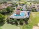 Aerial view showing the pool and spa area, complete with lounge chairs, for community residents at 16049 Volterra Pt, Bella Collina, FL 34756