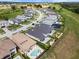 Aerial view of an upscale neighborhood with a community golf course and manicured lawns at 16049 Volterra Pt, Bella Collina, FL 34756