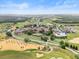 Expansive aerial view of the community, featuring luxury homes, pristine golf courses, and lush greenery at 16049 Volterra Pt, Bella Collina, FL 34756