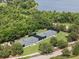 Overhead view of the community tennis courts, showcasing the well-maintained facilities and surrounding greenery at 16049 Volterra Pt, Bella Collina, FL 34756